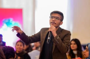 Umair Farooq speaking passionately at a youth empowerment seminar, representing Rosetech and Pakdigit.